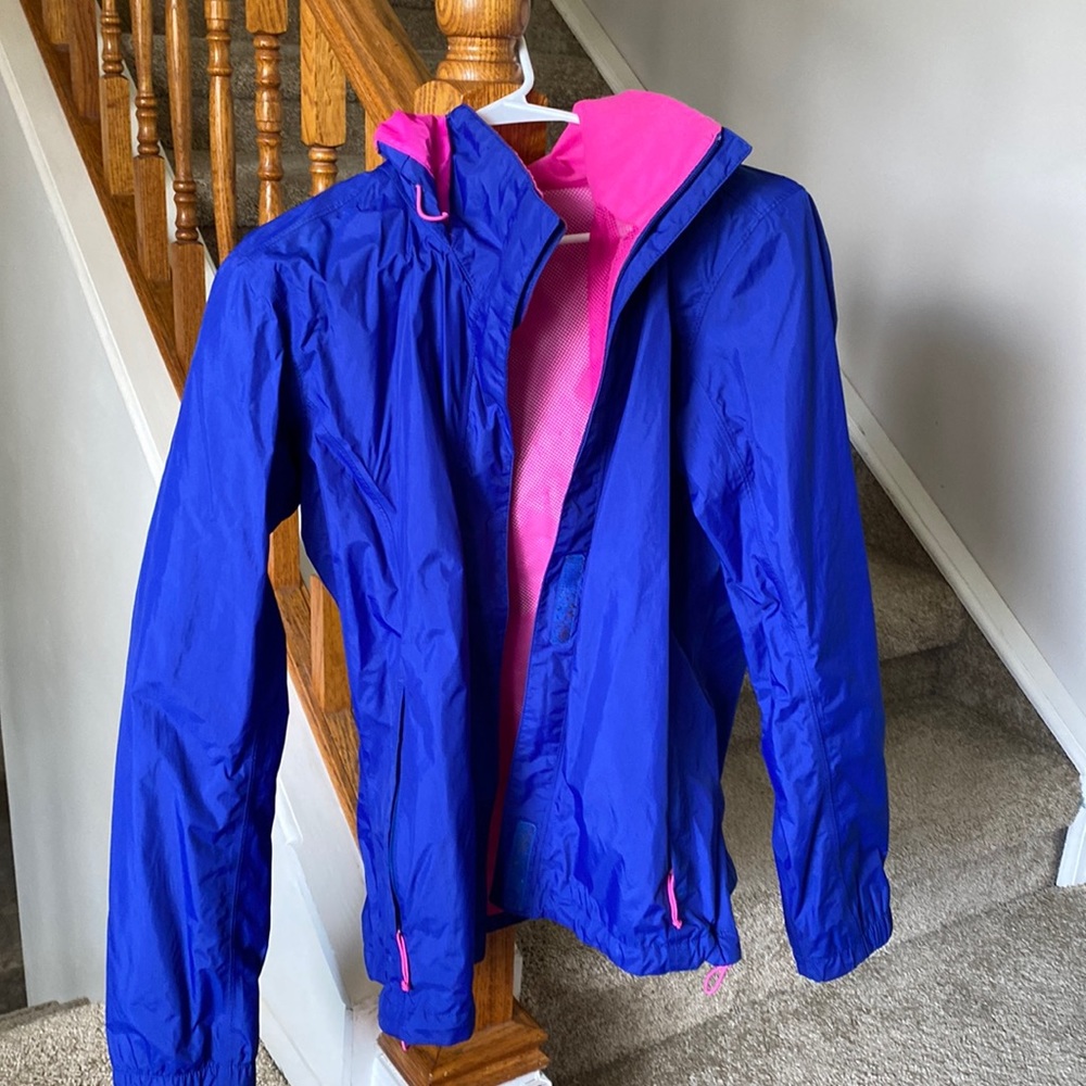Blue and pink North Face rain jacket